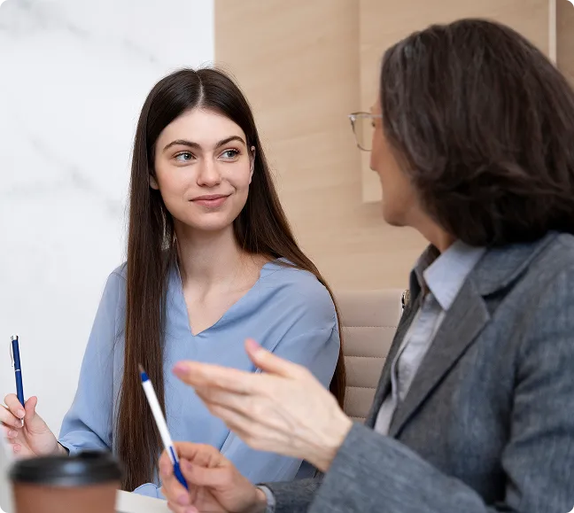 Two professionals discussing partner onboarding